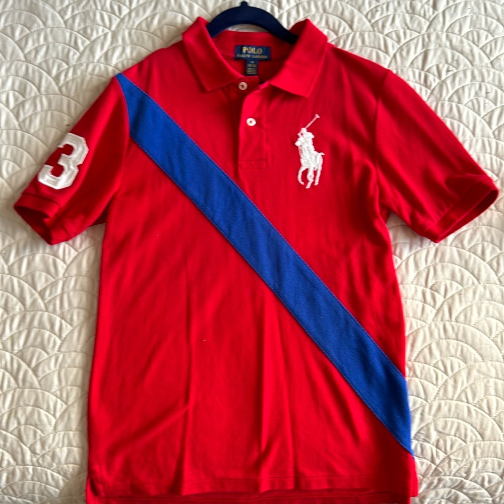 Boy’s Polo Shirt in red, blue, white. Size M 10-12 Used twice.No stains/rips.